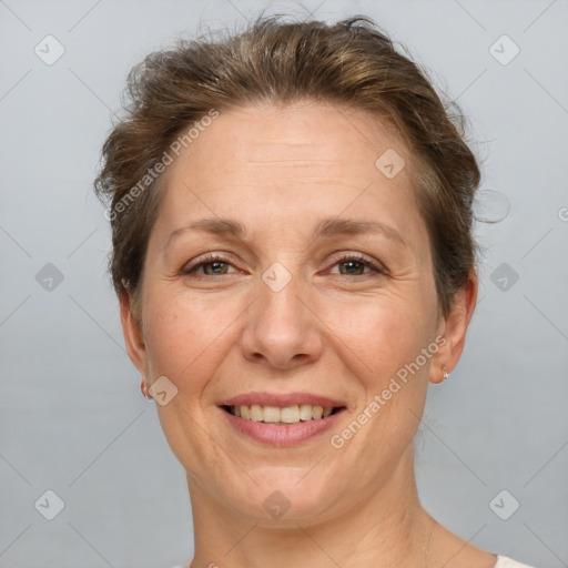 Joyful white adult female with short  brown hair and brown eyes