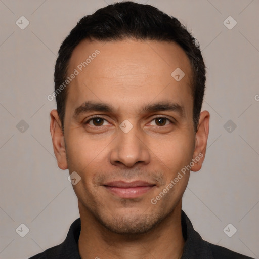 Joyful white young-adult male with short  black hair and brown eyes