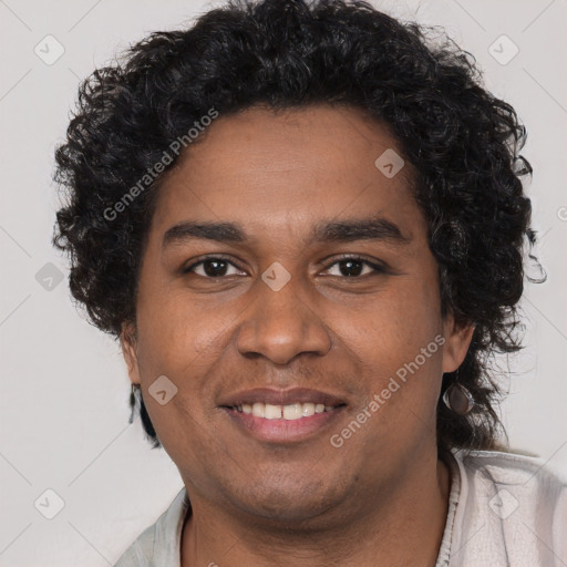 Joyful black young-adult male with short  brown hair and brown eyes