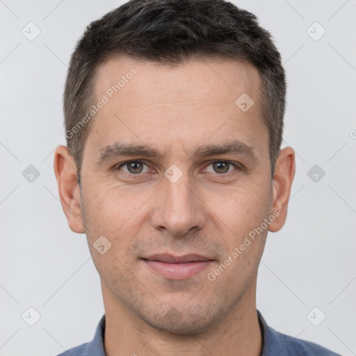 Joyful white adult male with short  brown hair and brown eyes