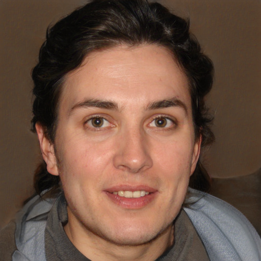 Joyful white young-adult male with medium  brown hair and brown eyes