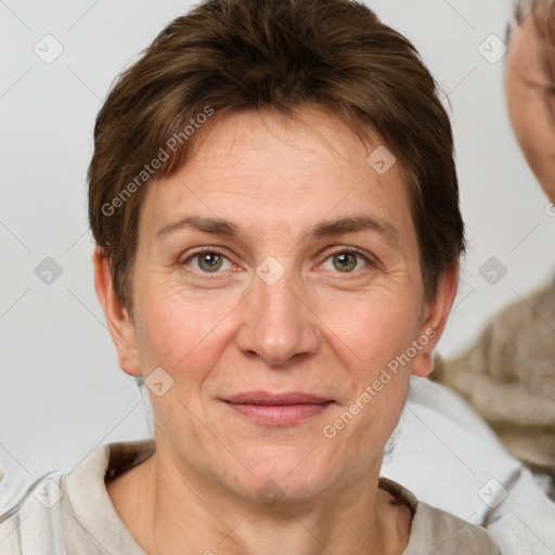 Joyful white adult female with short  brown hair and grey eyes