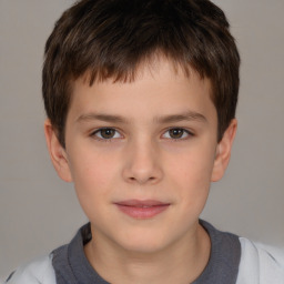 Joyful white child male with short  brown hair and brown eyes