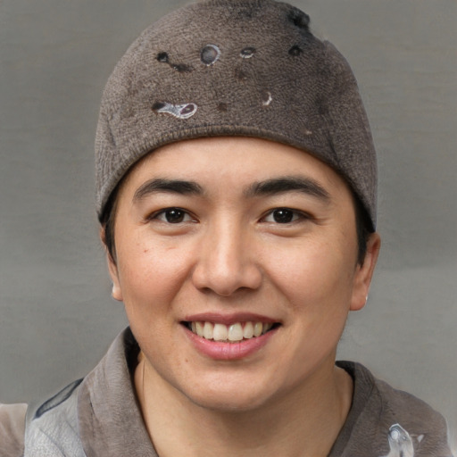 Joyful white young-adult female with short  black hair and brown eyes
