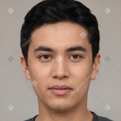 Joyful white young-adult male with short  black hair and brown eyes