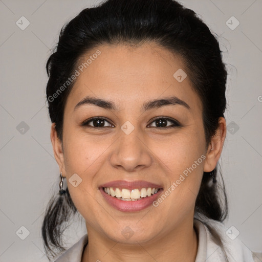 Joyful latino young-adult female with medium  brown hair and brown eyes