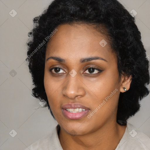 Joyful black young-adult female with medium  black hair and brown eyes