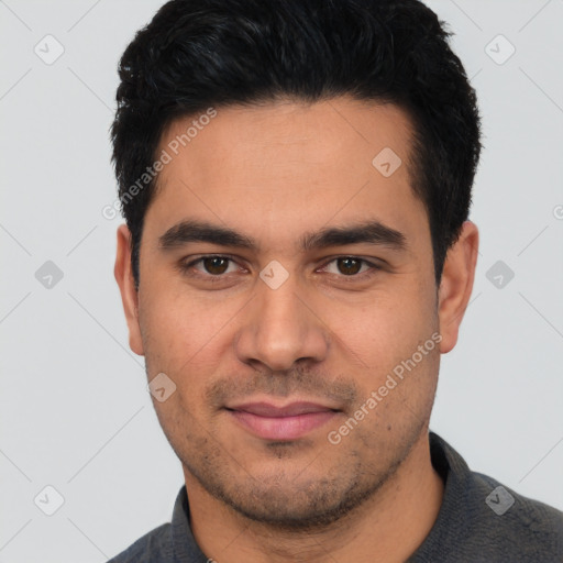 Joyful white young-adult male with short  black hair and brown eyes