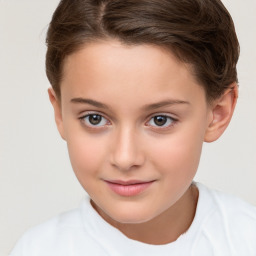 Joyful white child female with short  brown hair and brown eyes