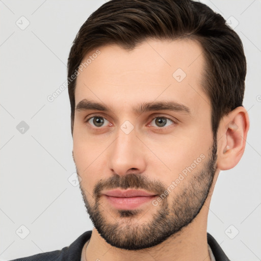 Joyful white young-adult male with short  brown hair and brown eyes