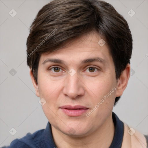 Joyful white adult male with short  brown hair and grey eyes