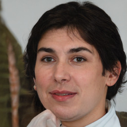 Joyful white adult female with medium  brown hair and brown eyes