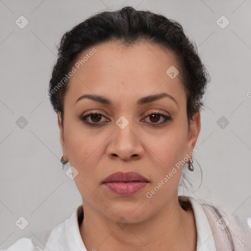 Joyful latino adult female with short  brown hair and brown eyes