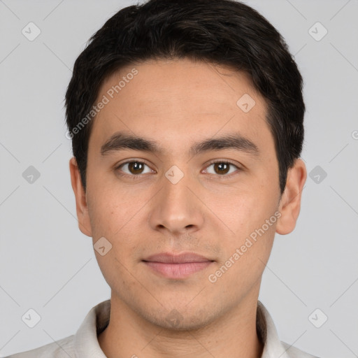 Joyful white young-adult male with short  black hair and brown eyes