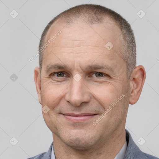 Joyful white adult male with short  brown hair and brown eyes