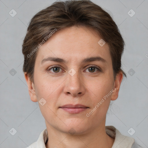 Joyful white young-adult female with short  brown hair and grey eyes