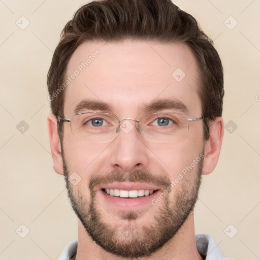 Joyful white young-adult male with short  brown hair and grey eyes