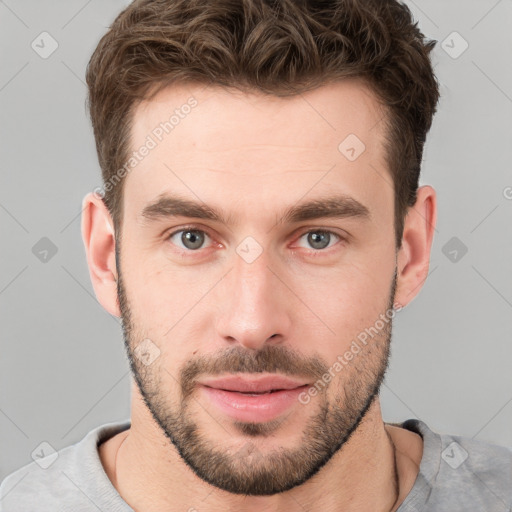 Neutral white young-adult male with short  brown hair and grey eyes