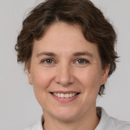 Joyful white adult female with short  brown hair and brown eyes