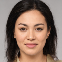 Joyful asian young-adult female with medium  brown hair and brown eyes