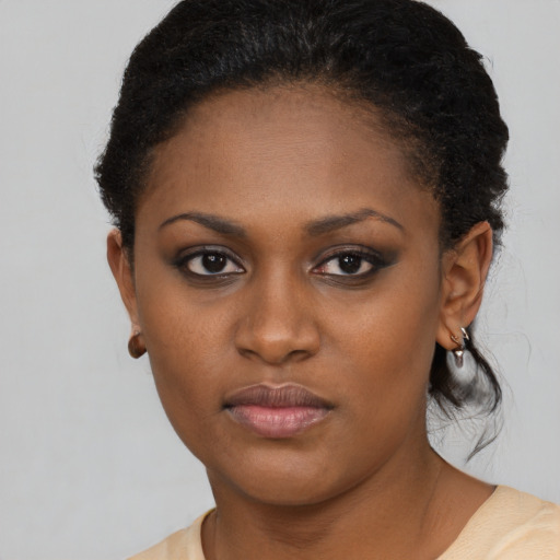 Neutral black young-adult female with short  brown hair and brown eyes