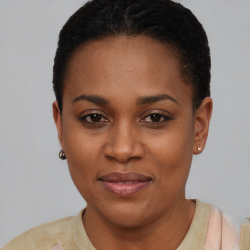 Joyful latino young-adult female with short  black hair and brown eyes