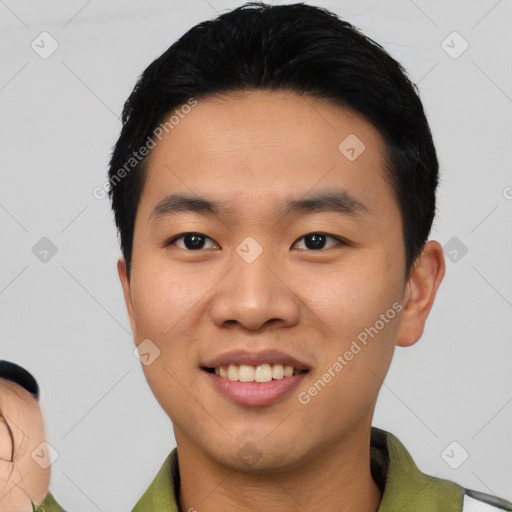 Joyful white young-adult male with short  black hair and brown eyes