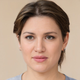 Joyful white young-adult female with medium  brown hair and grey eyes