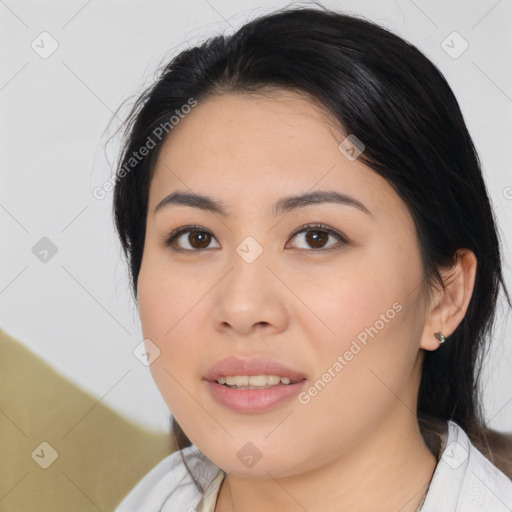 Joyful asian young-adult female with medium  black hair and brown eyes