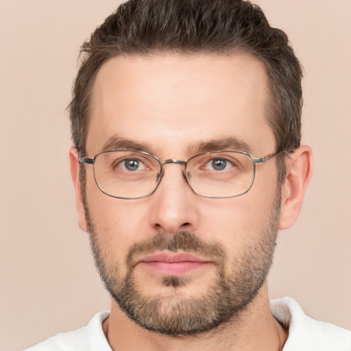 Joyful white adult male with short  brown hair and brown eyes