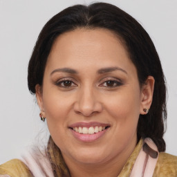 Joyful white adult female with medium  brown hair and brown eyes