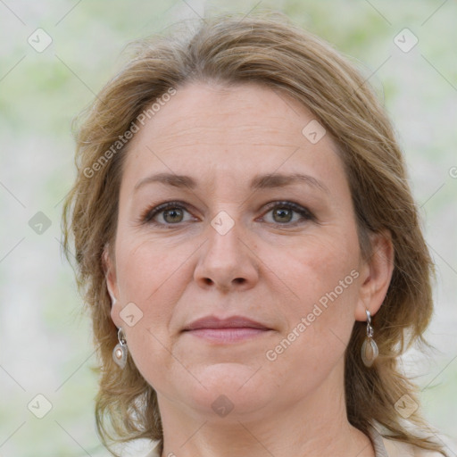 Joyful white adult female with medium  brown hair and grey eyes