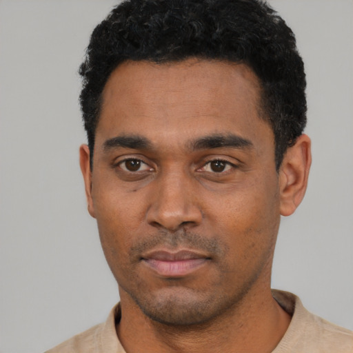 Neutral black young-adult male with short  black hair and brown eyes