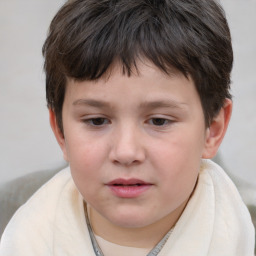 Joyful white child male with short  brown hair and brown eyes