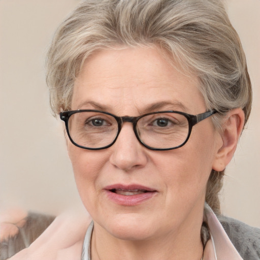 Joyful white middle-aged female with medium  blond hair and blue eyes