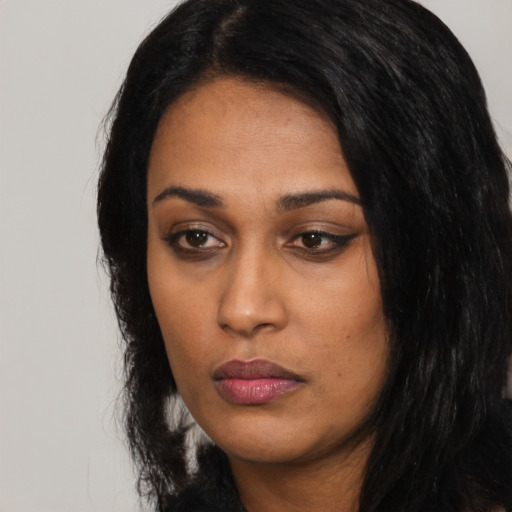 Neutral black young-adult female with long  black hair and brown eyes