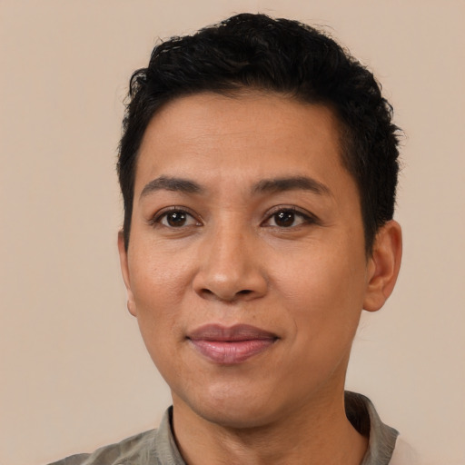 Joyful latino young-adult female with short  black hair and brown eyes