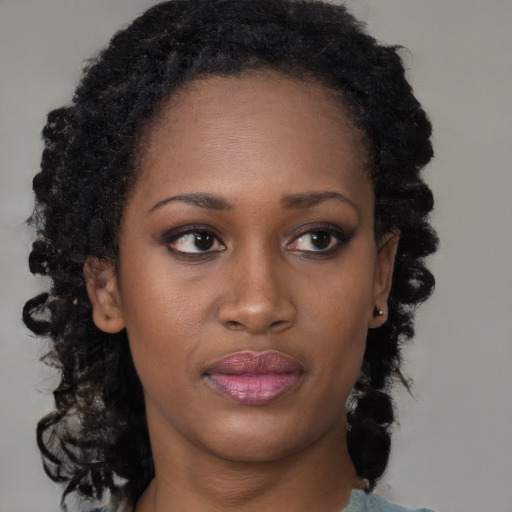 Neutral black young-adult female with medium  brown hair and brown eyes