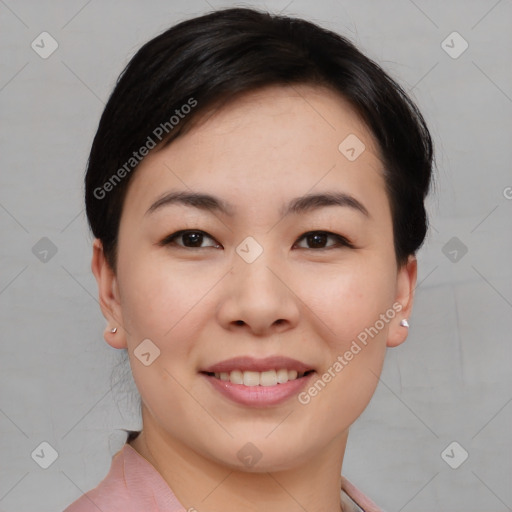 Joyful asian young-adult female with short  brown hair and brown eyes