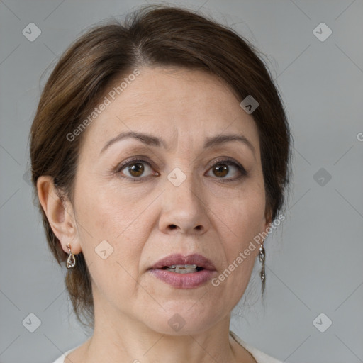 Joyful white adult female with medium  brown hair and brown eyes