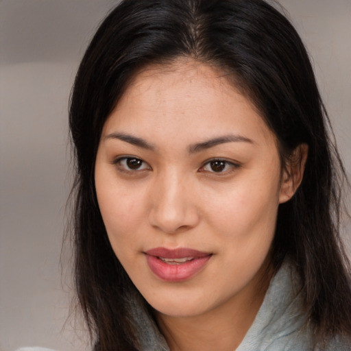 Joyful asian young-adult female with medium  brown hair and brown eyes