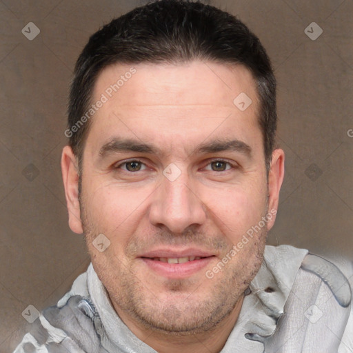 Joyful white adult male with short  brown hair and brown eyes