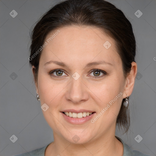 Joyful white adult female with medium  brown hair and grey eyes