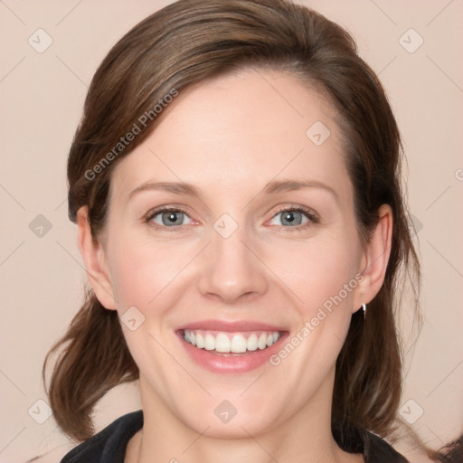 Joyful white young-adult female with medium  brown hair and grey eyes