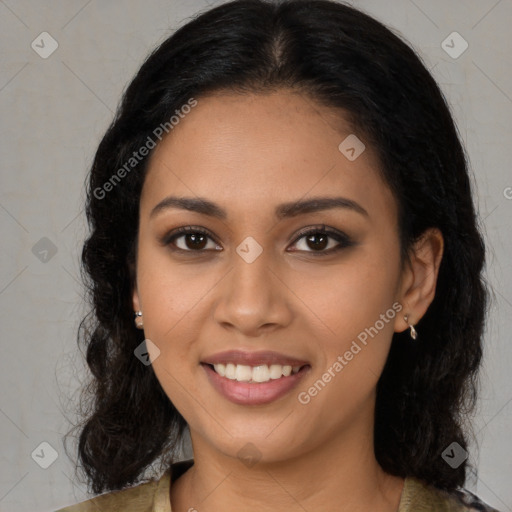 Joyful latino young-adult female with long  brown hair and brown eyes