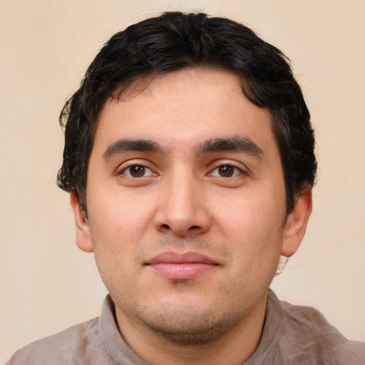 Neutral white young-adult male with short  black hair and brown eyes