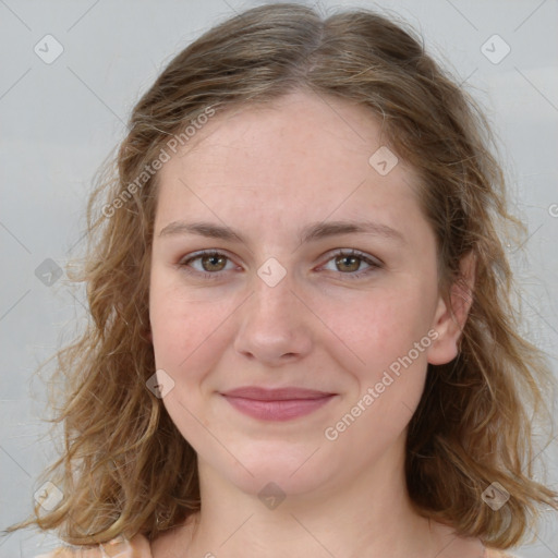 Joyful white young-adult female with medium  brown hair and green eyes