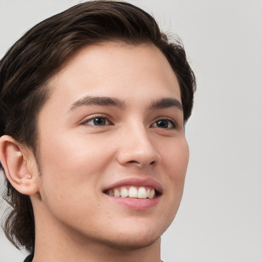 Joyful white young-adult male with medium  brown hair and brown eyes