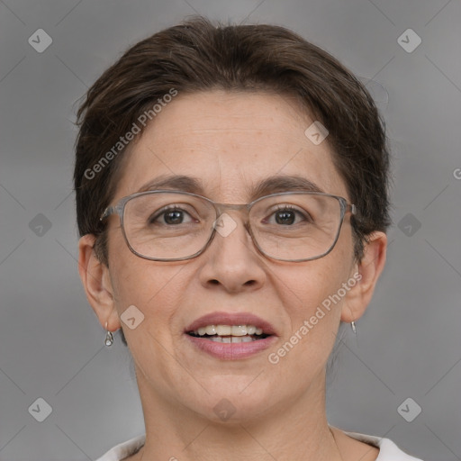 Joyful white adult female with short  brown hair and brown eyes