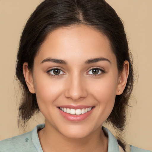 Joyful white young-adult female with medium  brown hair and brown eyes